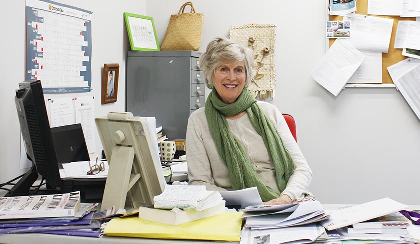 Anne Manchester at her desk