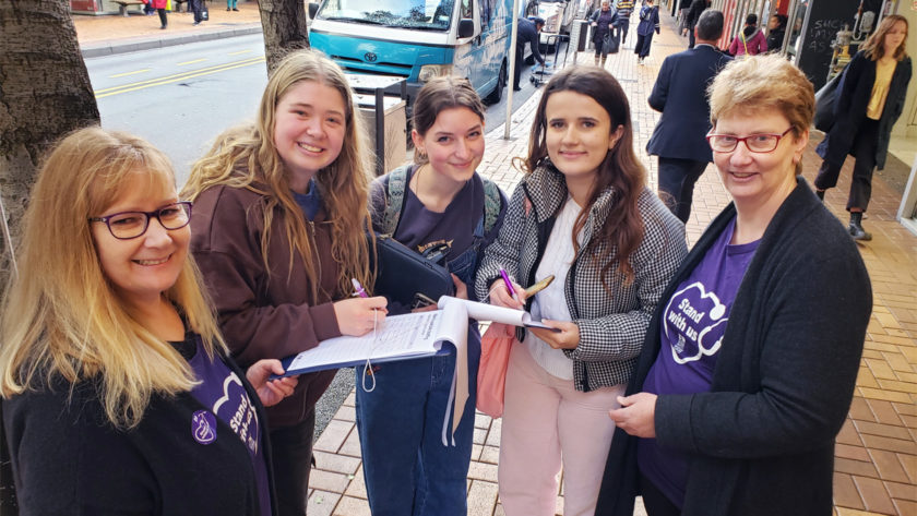 ‘One woman waited nine hours in ED’: Organisers hit streets to gather support for nursing cause Hordes of mid-afternoon walkers blasted up and down Willis St, Wellington, but there were clipboards, pens and the nursing kaupapa awaiting their attention.