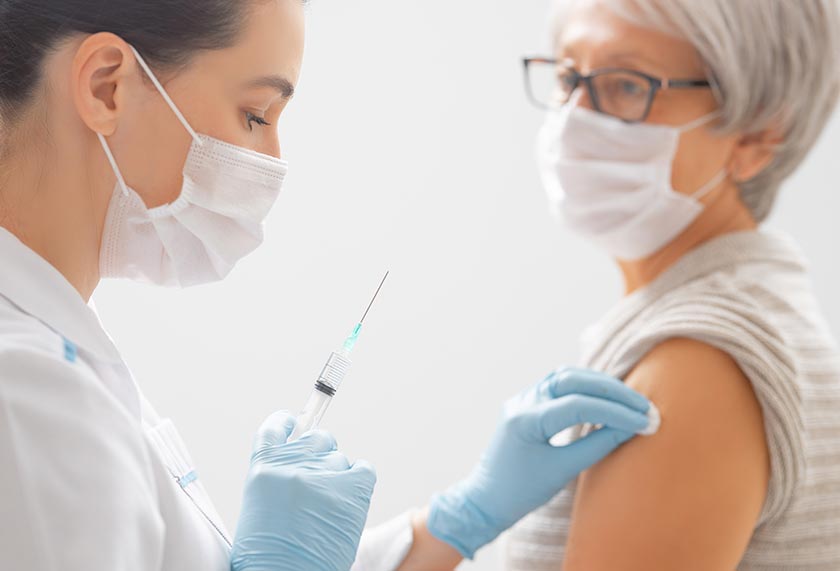 Nurse vaccinating a patient