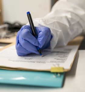 Healthcare worker making notes