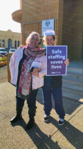 Nurses with 'Safe staffing saves lives' sign