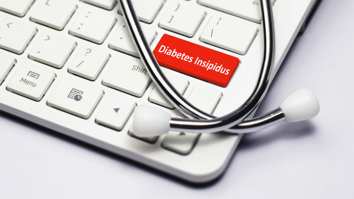 Diabetes Insipidus text, stethoscope lying down on the cumputer keyboard