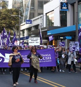 NZNO kaiwhakahaere Kerri Nuku and acting president Tracey Morgan lead members through Wellington during the first DHB members' strike.