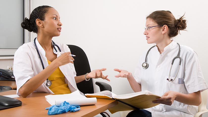 Two student nurses having a discussion