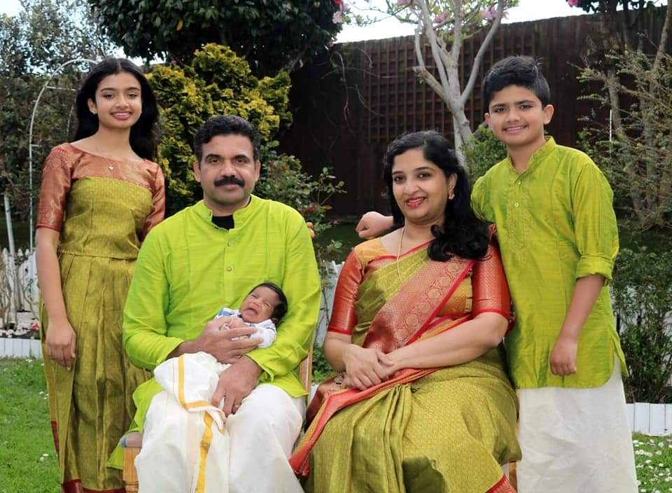 Saju Cherian with his wife and children.