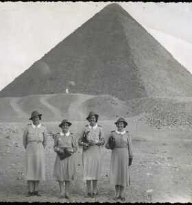 Four NZANS nurses, posed in front of a pyramid in Egypt (c 1941 – 1943). Photo from the Nancy Frances Carter Collection by courtesy of the South Canterbury Museum.
