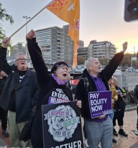 Some nurses were leaving a long shift, others gearing up to start one -- they were the first links in a literal, and figurative, chain across Aotearoa for workers' rights.